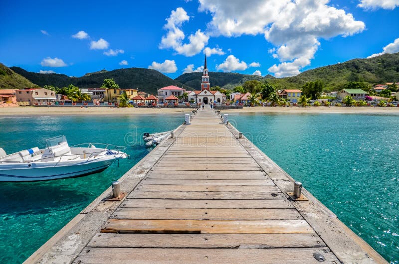 Beach viex from pontoon Sea, sun, boat, church and awesome colors Martinique, france, caraibes. Beach viex from pontoon Sea, sun, boat, church and awesome colors Martinique, france, caraibes