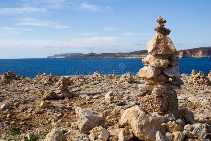 MARSAXLOKK, MALTA - 01 JAN, 2020: Balancing rocks at the seaside, near the former Azure Window on the island of Gozo. MARSAXLOKK, MALTA - 01 JAN, 2020: Balancing rocks at the seaside, near the former Azure Window on the island of Gozo.