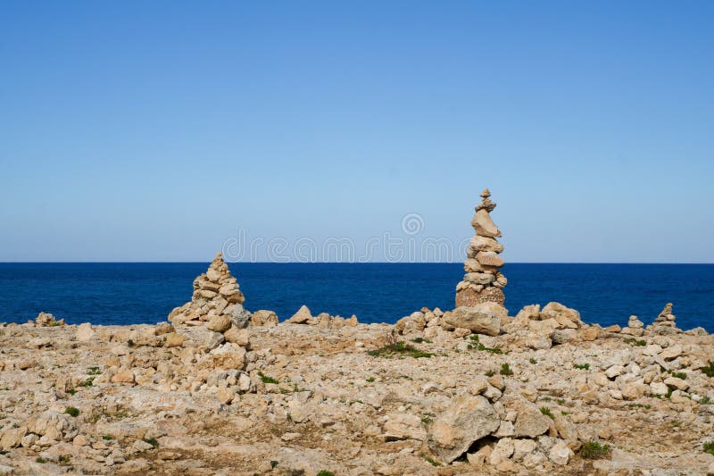 MARSAXLOKK, MALTA - 01 JAN, 2020: Balancing rocks at the seaside, near the former Azure Window on the island of Gozo. MARSAXLOKK, MALTA - 01 JAN, 2020: Balancing rocks at the seaside, near the former Azure Window on the island of Gozo.