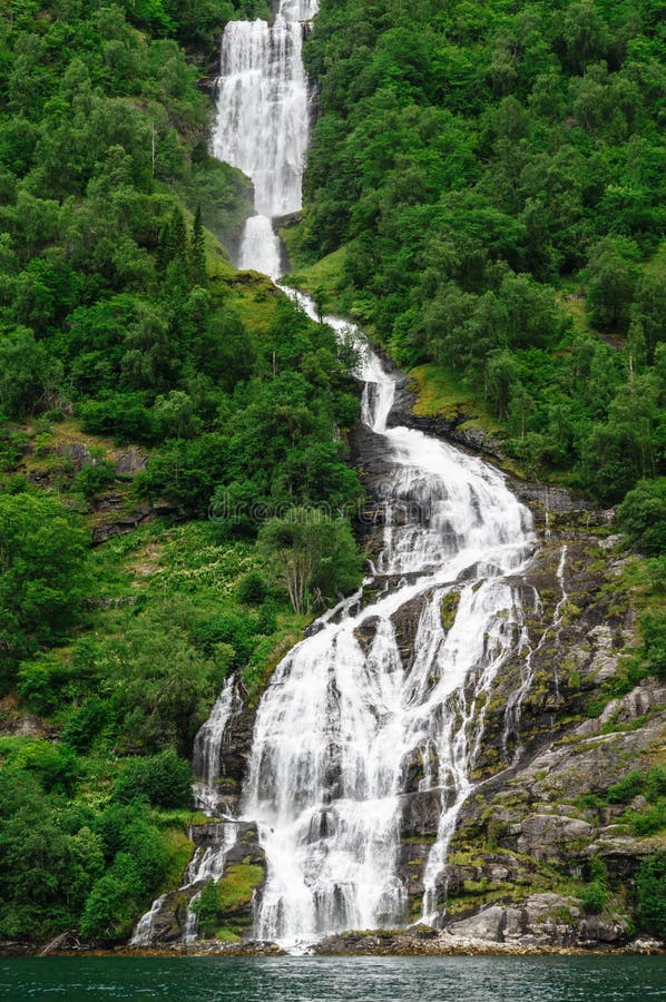 High norwegian waterfall inflowing into Geiranger fjord. High norwegian waterfall inflowing into Geiranger fjord