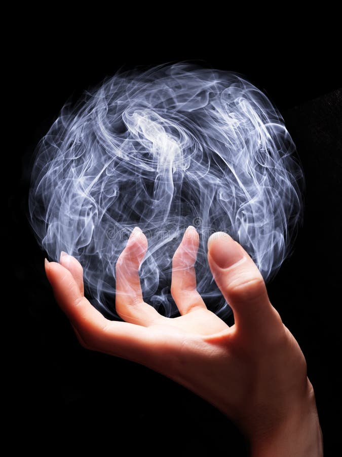 Hand of a young wizard creating a magical sphere. Hand of a young wizard creating a magical sphere.