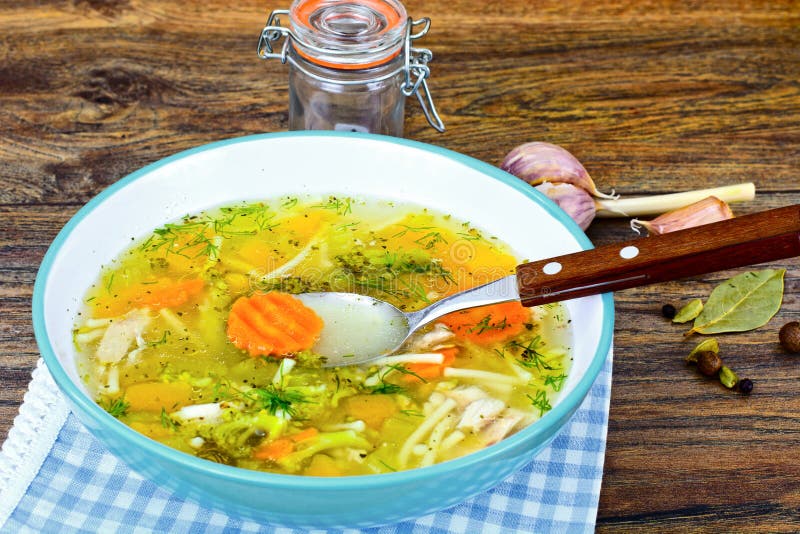 Chicken Soup with Broccoli, Carrots and Celery, Pumpkin and Noodles Studio Photo. Chicken Soup with Broccoli, Carrots and Celery, Pumpkin and Noodles Studio Photo