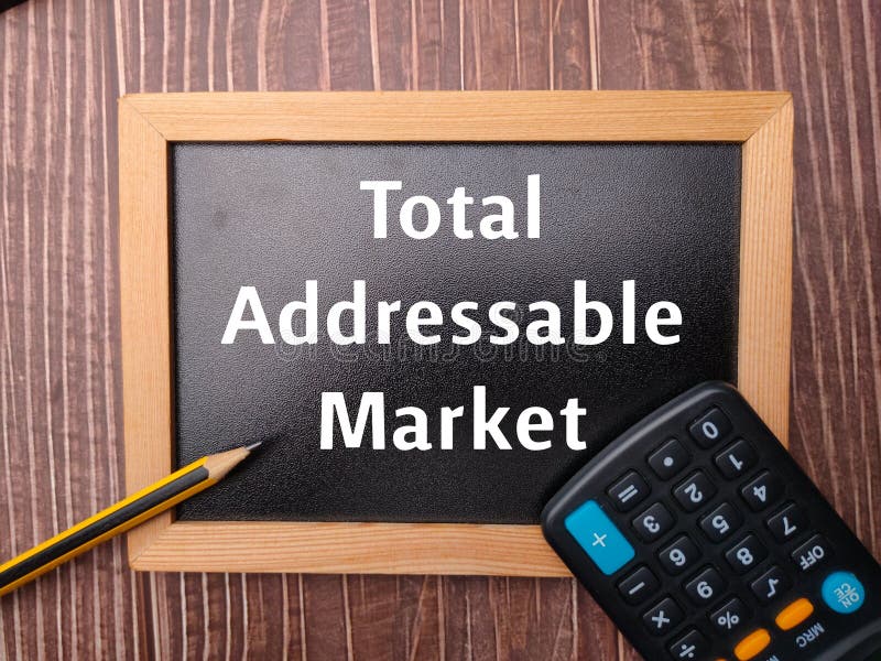 Black wooden board and pencil with the word Total Addressable Market. Black wooden board and pencil with the word Total Addressable Market.