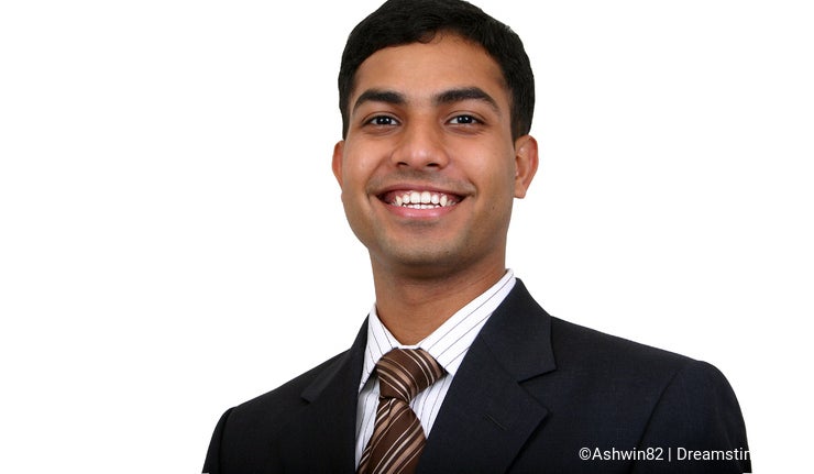 Indian business man smiling.
