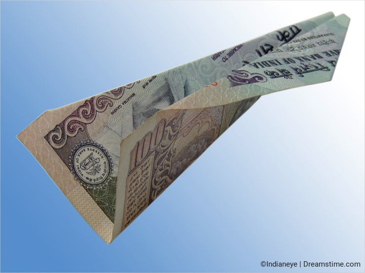 Flying plane of an Indian 100 rupee note