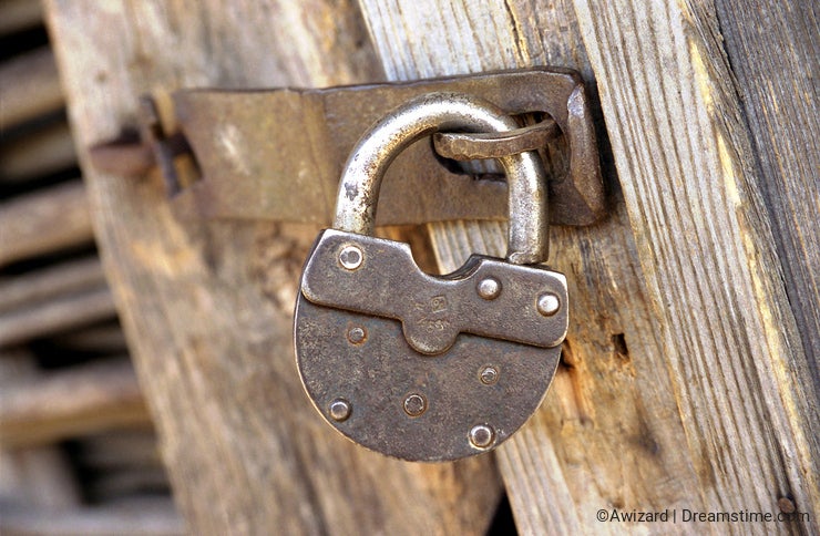 Metal lock on wooden door