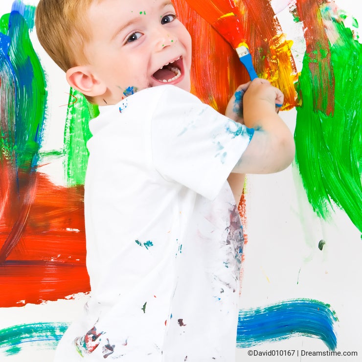 Child painting and having fun