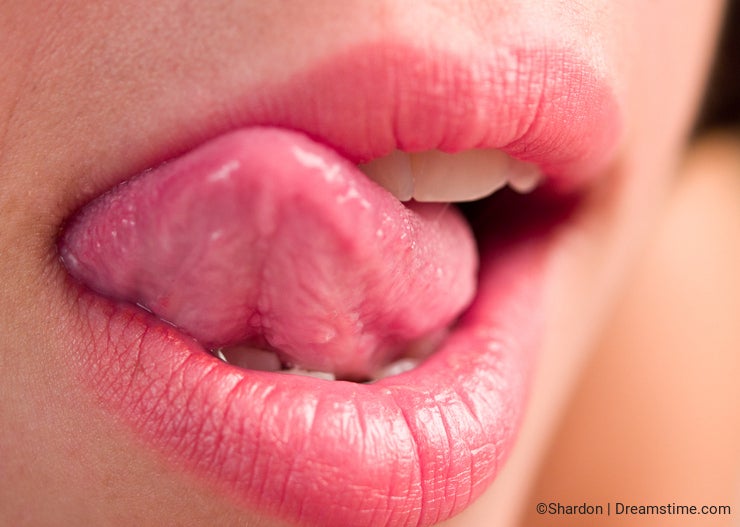 Woman licking lips 