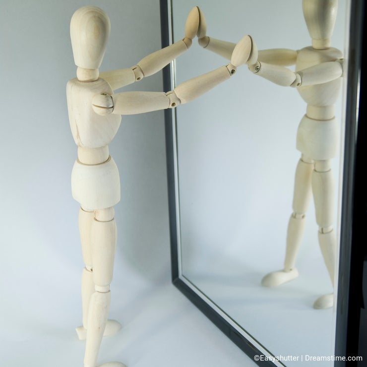 Mannequin looking in mirror