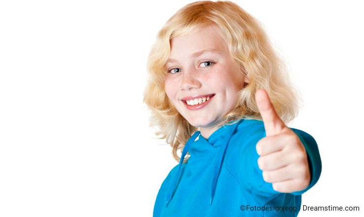 Young beautiful girl / child shows thumb up