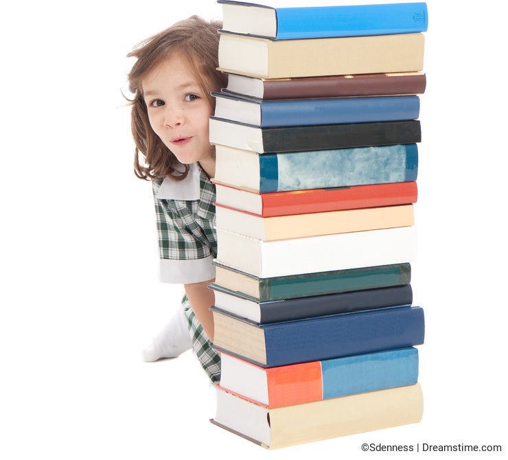 School girl hiding behind books