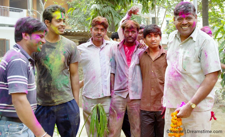 Men covered in paint for Holi festival