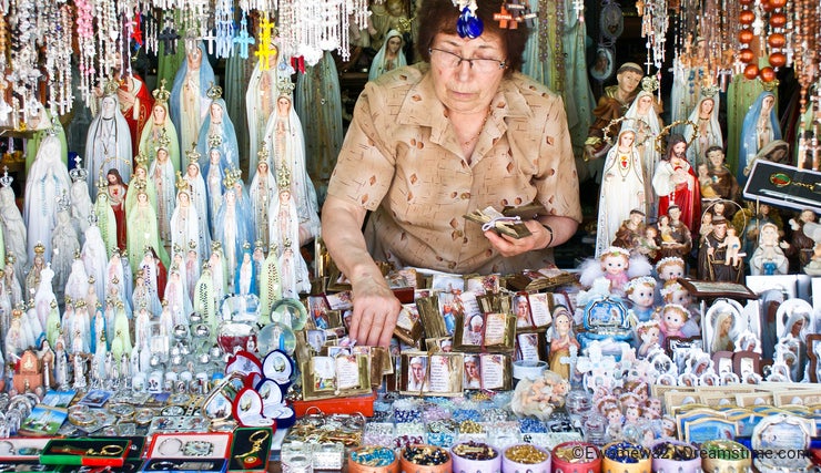 Woman selling religious articles