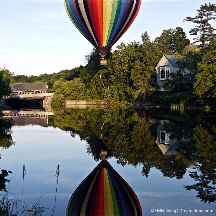 Peaceful Hot Air Balloon over river in Vermont