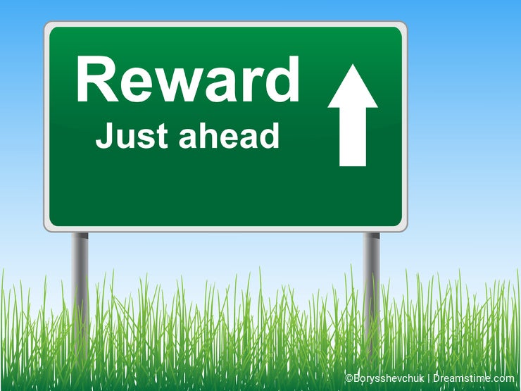 Reward road sign on the sky background.