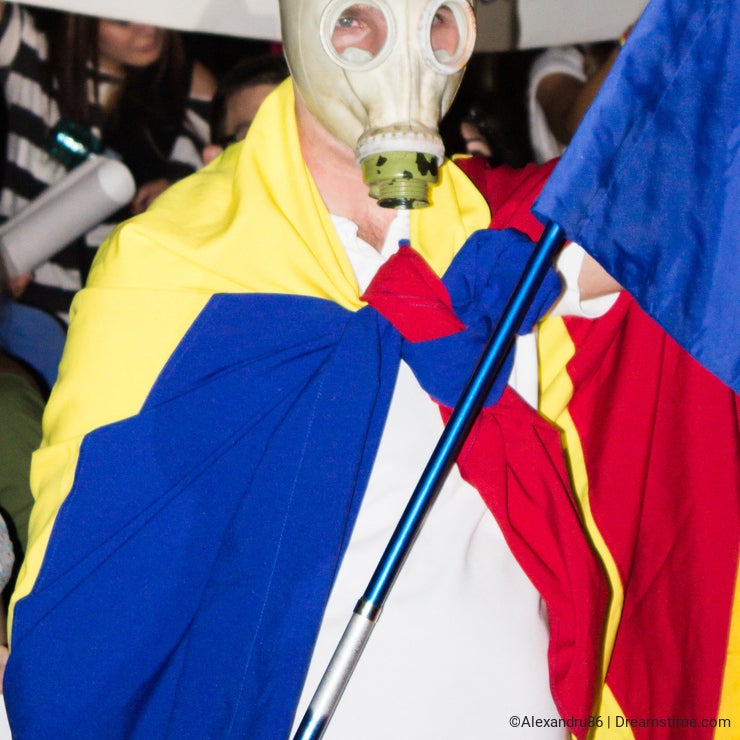 Romanian gas mask protester against Rosia Montana