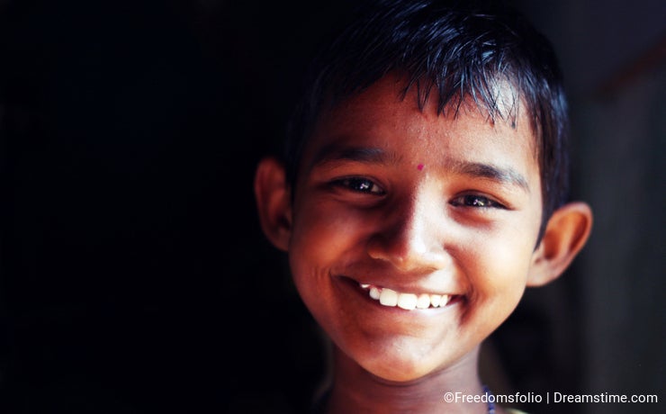 A girl child smiles at an orphanage