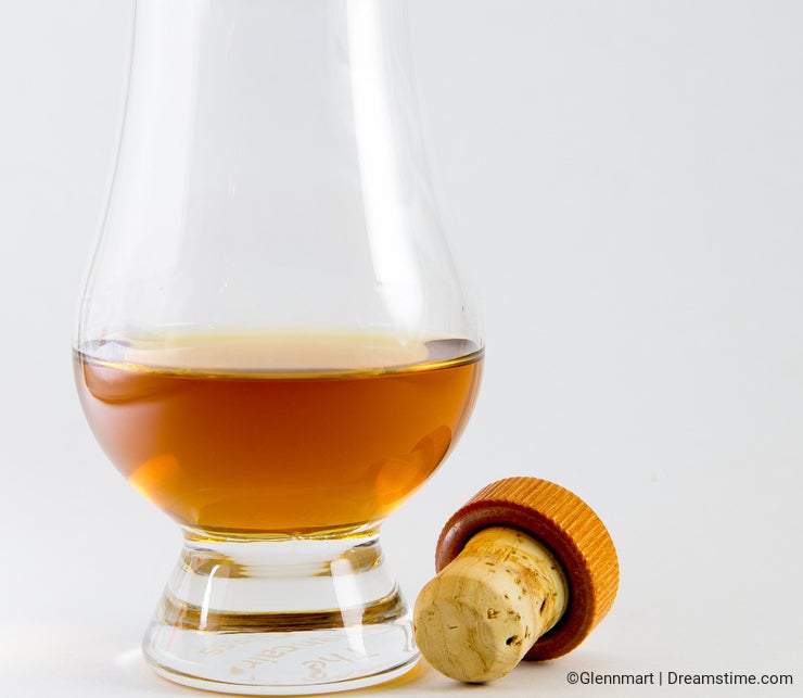 Whisky in a whiskey glass with a cork