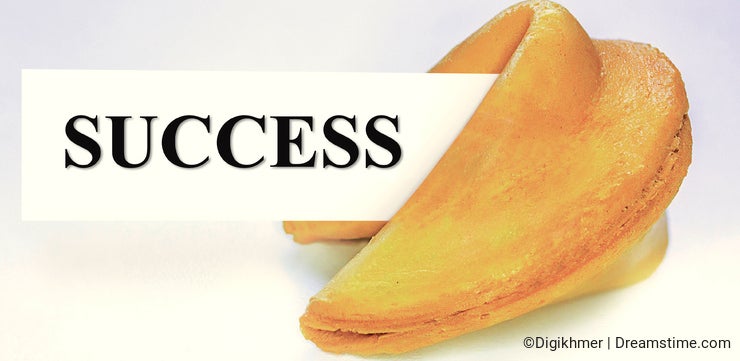 Fortune cookie with success sheet