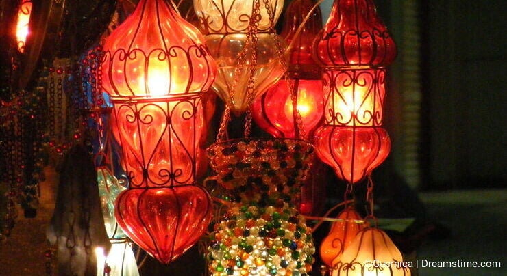 Close up of Shining lanterns in khan el khalili souq market with Arabic handwriting on it in egypt cairo
