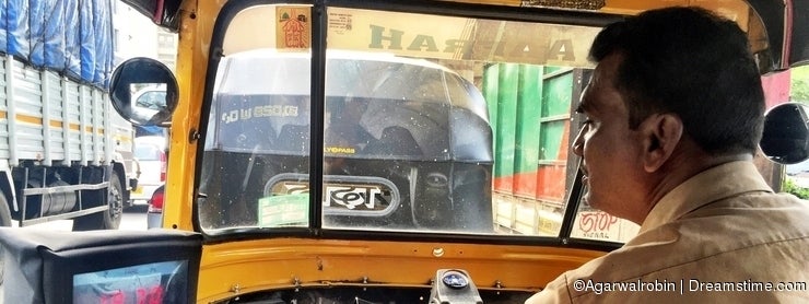 A man driving his auto