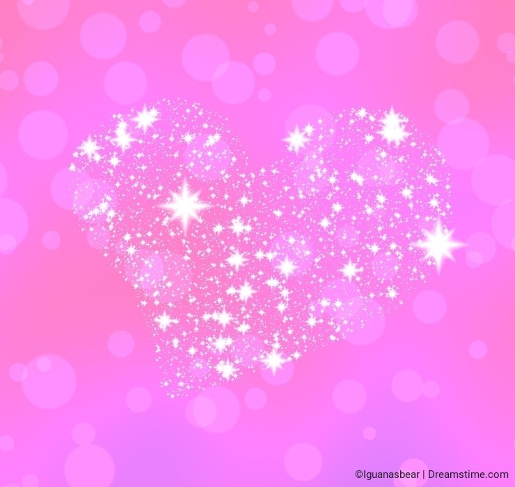 Soft heart composed of white stars on pink bokeh background