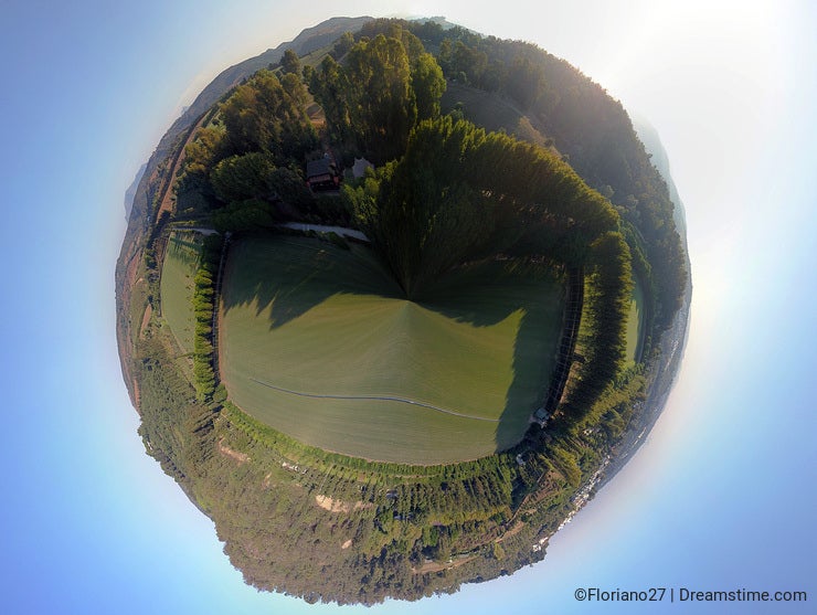 Aerial 360 degrees panorama over hills and polo fields at sunset