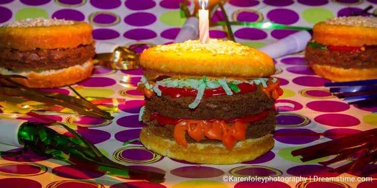 Dessert imposter cheeseburgers and hamburgrer with birthday candle