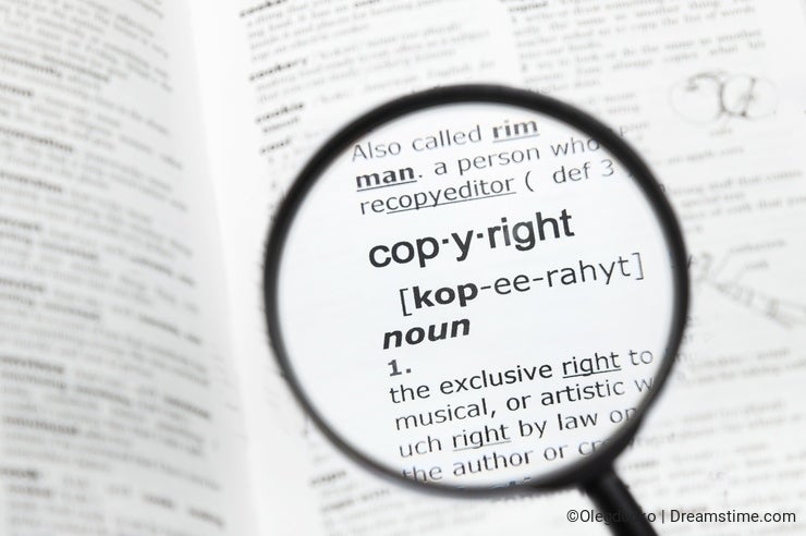 Magnifying glass over the definition of `copyright