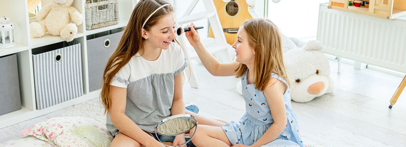 girls kids doing makeup with brush cute girls kids doing makeup with brush in playroom