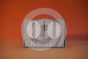 0 Februar on wooden grey cubes. Funny calendar date 00 February. Concept of date. Copy space for text