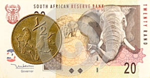 005 south african aforika coin against 20 south african rand