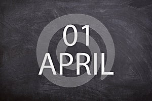 01 April text with blackboard background for calendar.