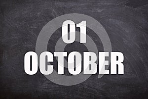01 October text with blackboard background for calendar.