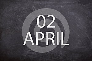 02 April text with blackboard background for calendar.