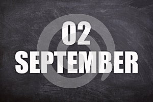 02 September text with blackboard background for calendar.