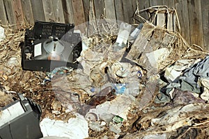 03-05-2020. Syktyvkar, Russia. Heap of garbage with bags, plastic, dry grass, cardboard and bottles