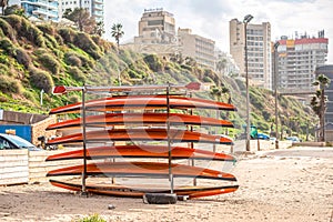 05/12/2018 Netanya, Israel, sup boards are holded on the beach of Mediterranean Sea