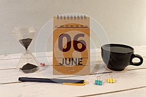 06 sixth june Month Calendar Concept on Wooden Blocks. Close up.