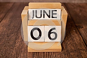 06 sixth june Month Calendar Concept on Wooden Blocks. Close up.