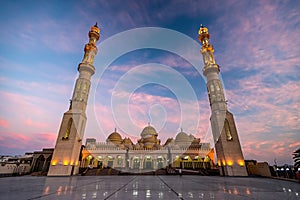 09/11/2018 Hurghada, Egypt, New snow-white mosque Al Mina on the Red Sea coast at dusk and highlighted