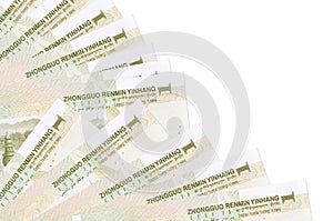 1 Chinese yuan bills lies isolated on white background with copy space stacked in fan close up