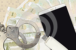 1 Chinese yuan bills and smartphone with police handcuffs. Concept of hackers phishing attacks, illegal scam or malware soft