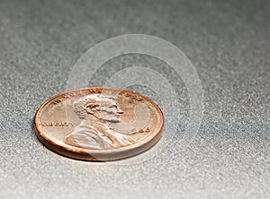 1 Dollar Cent with Lincoln on an alloy board