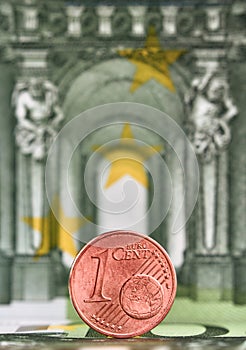 1 Euro cent against 100 Euro banknote, coins and banknotes of the single European currency. Money background