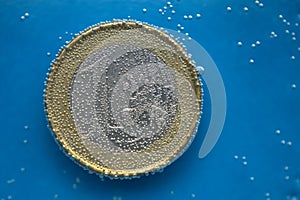 The 1 euro coin sinks in the water