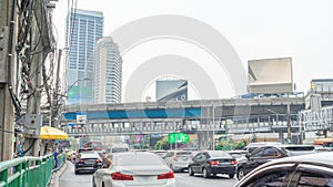 1 January 2024 in Bangkok, Thailand Image of cars parked at a red light in a long procession on a 5-lane road