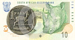 1 rand coin against 10 south african rand bank note obverse