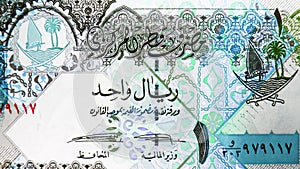 1 Riyal banknote, Bank of Qatar, closeup bill fragment shows Ornate column and arches, Coat of arms depicting sailboats, palm