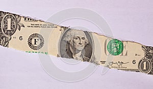 1 US dollar banknote in torn paper hole